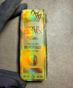 Gold Crown Hash showing golden trichomes and premium solventless craftsmanship during the hash-making process.trichomes and premium solventless craftsmanship during the hash-making process.